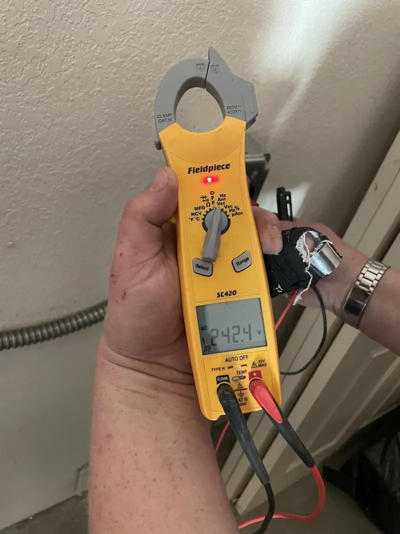 Voltage testing with clamp meter during Electrical Installation Services in Myerstown